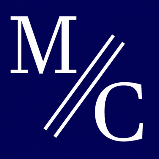 White letters "M" and "C" separated by two diagonal white lines on a dark blue background.