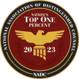 Circular badge with an eagle emblem in the center, labeled "Nation's Top One Percent 2023" and "National Association of Distinguished Counsel" around the edge.